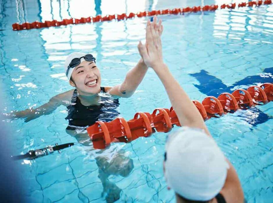 Two girls in a recreation center pool