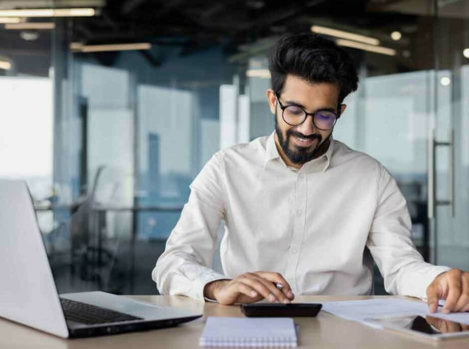 Office worker using a calculator