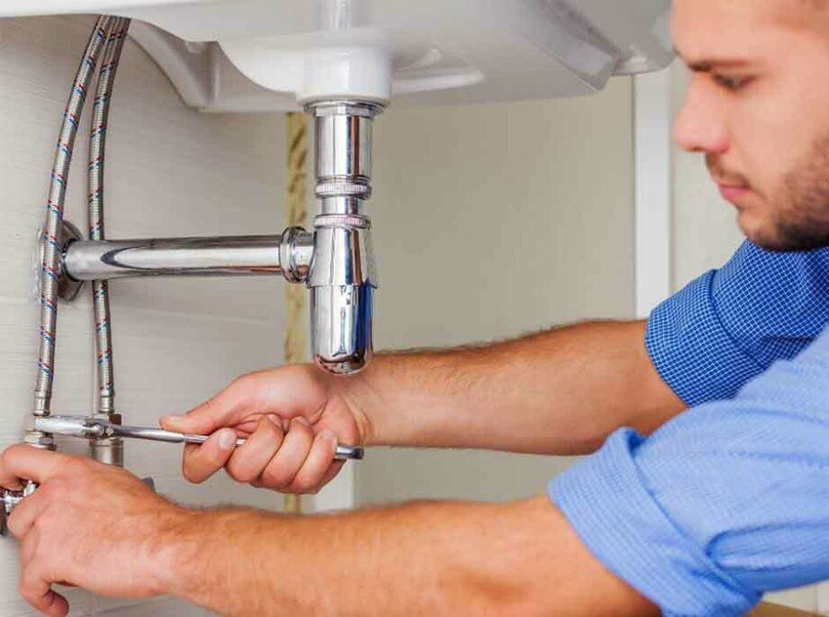 Plumber fixing repairing faucet