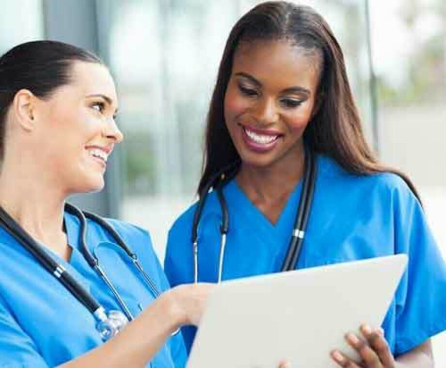 Two nurses reviewing patient file