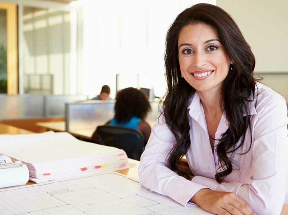 Woman architect looking at plans