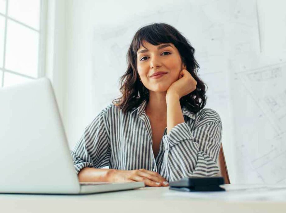 Woman engineer working on laptop