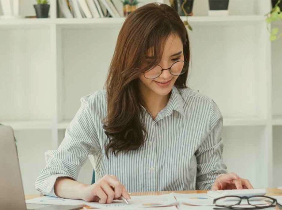 Woman reviewing resumes