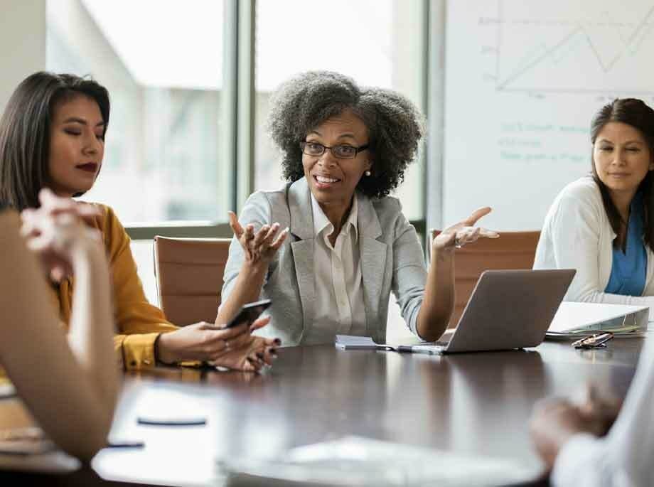 Women sitting around an office table