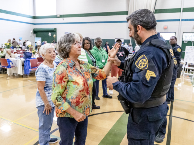 Deputy Sheriff instructing attendee in self defense methods