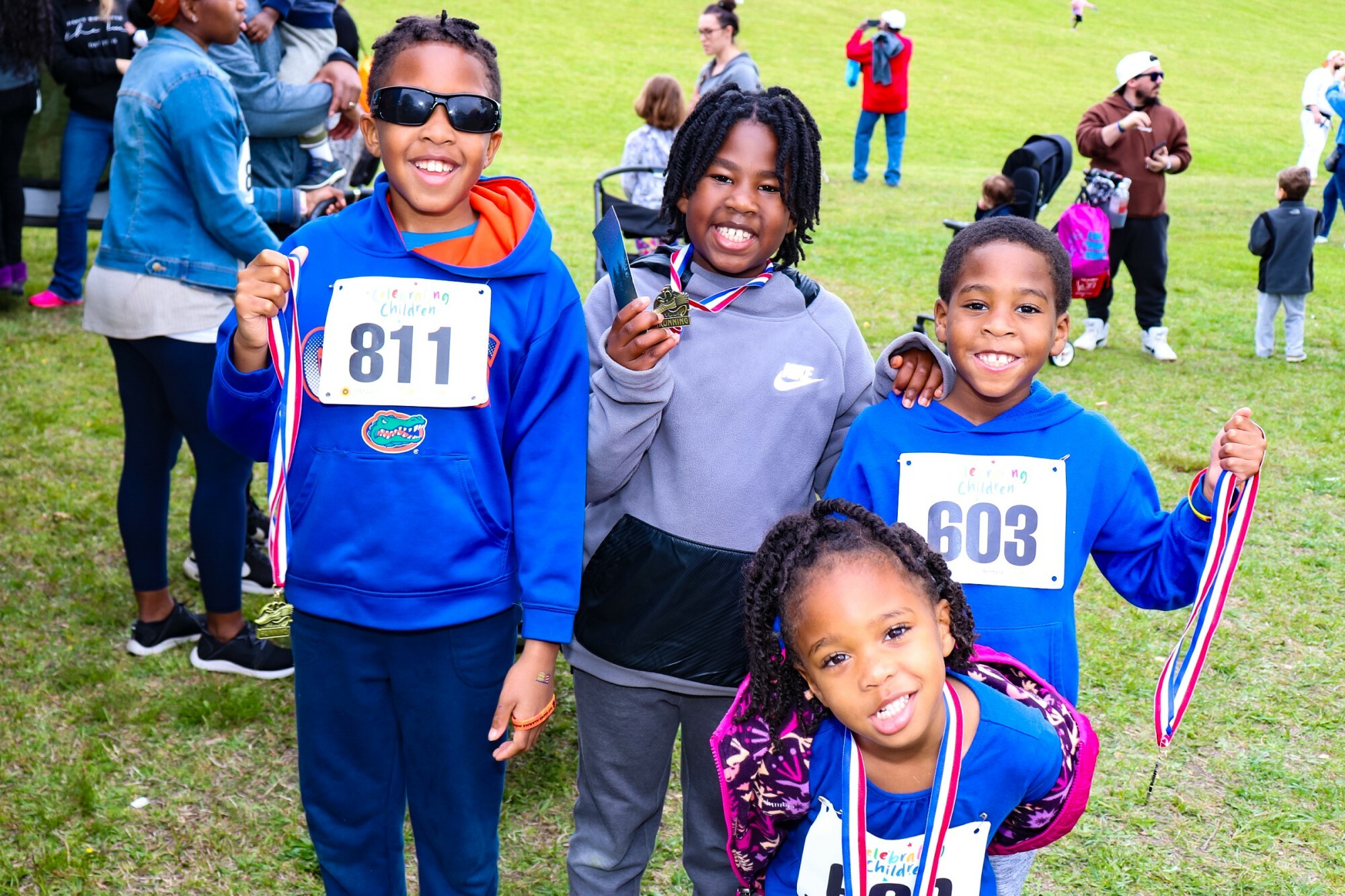 Fun Run kid participants and their medals