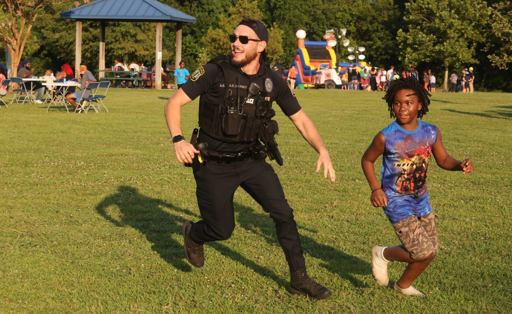 Virginia Beach Police Officer and child playing at Parks After Dark