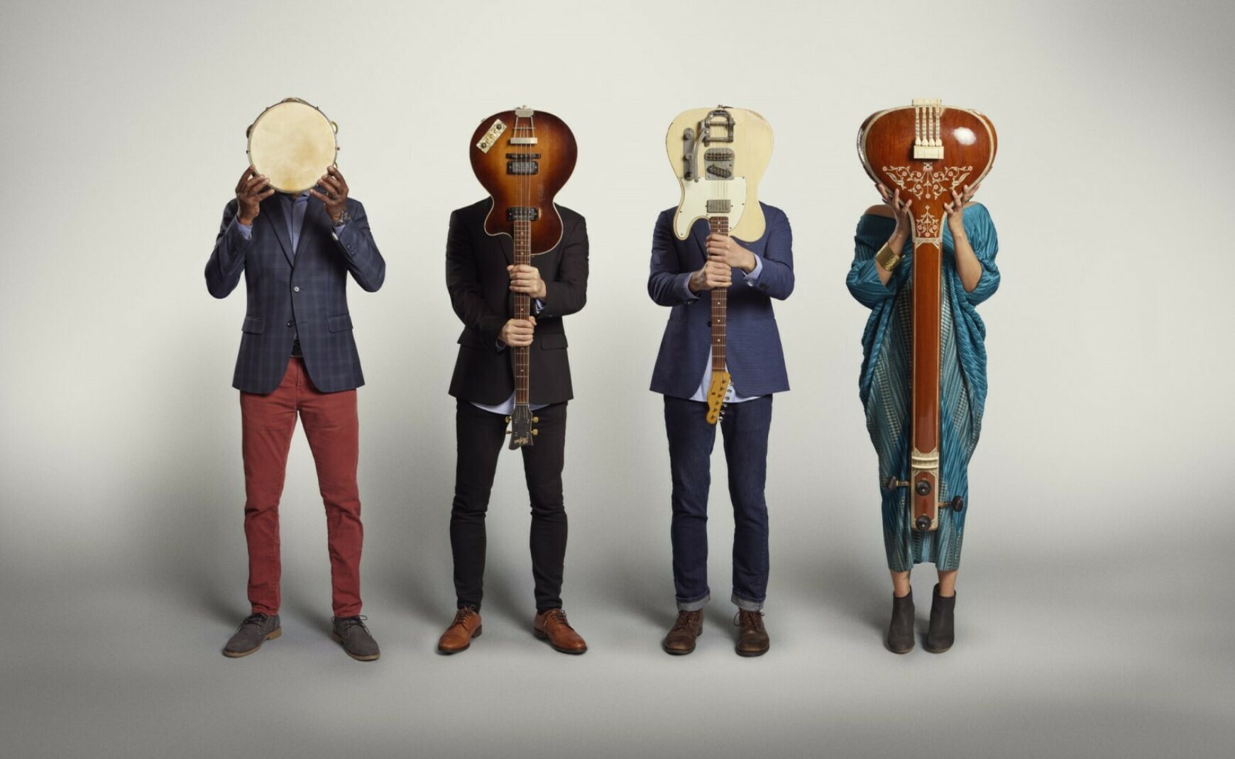 American Patchwork Quartet Band Members Holding Instruments in Front of Their Faces