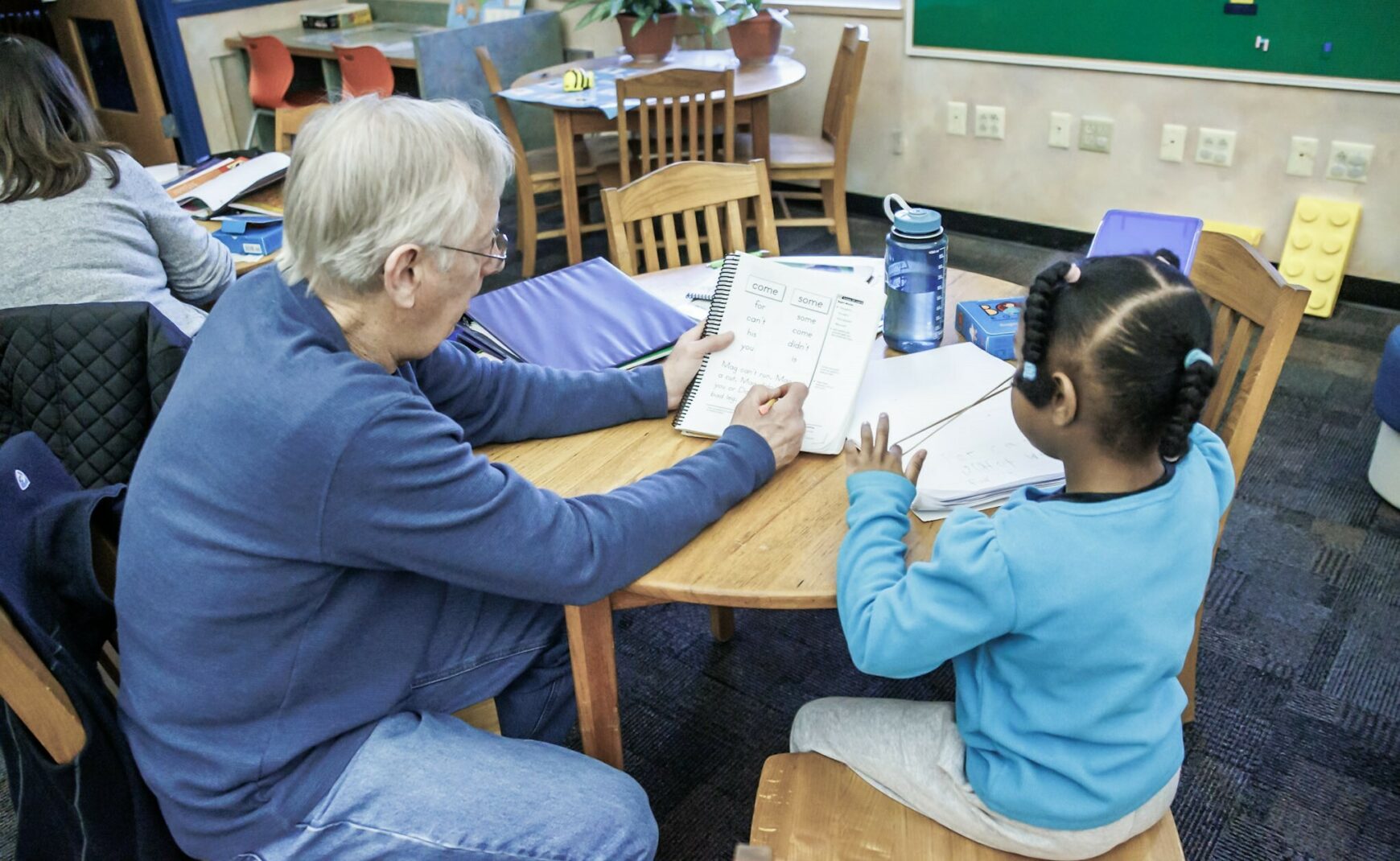 First Grade READS mentor with a student