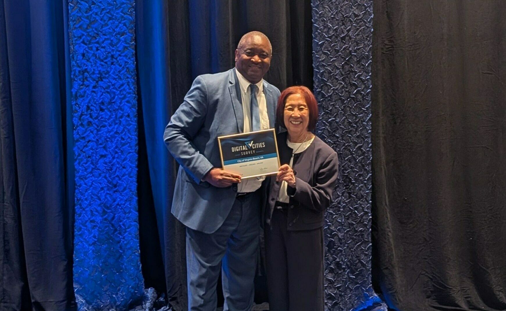 IT Department staff accepting Digital Cities Survey Award