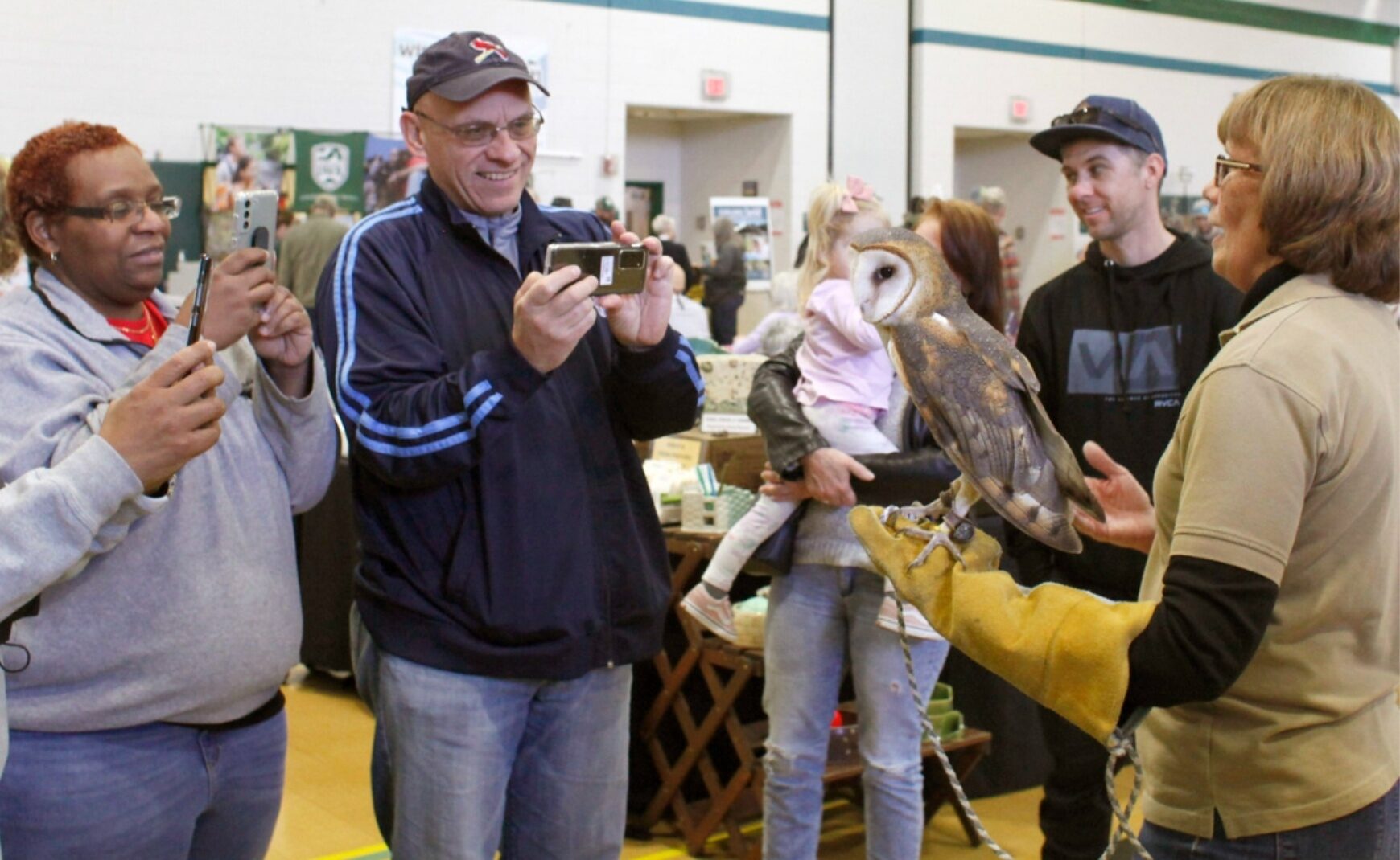 People Taking Photo of Owl at Winter Wildlife Festival