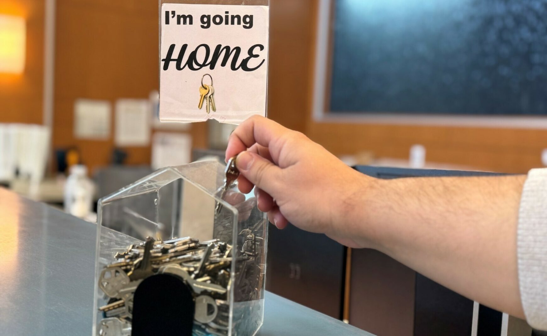 Putting key in key box at Housing Resource Center