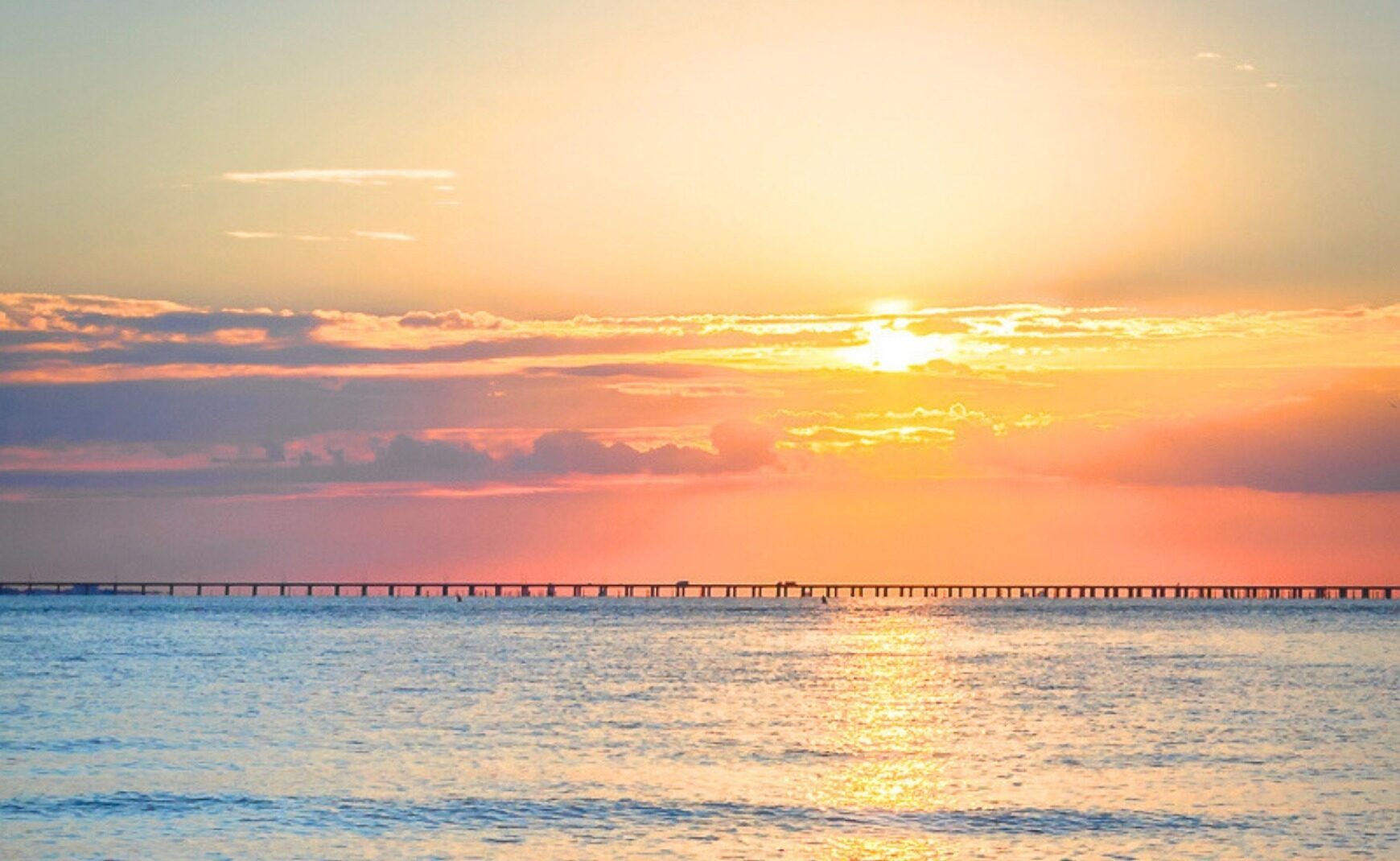Sun shining over Atlantic Ocean with CBBT in background