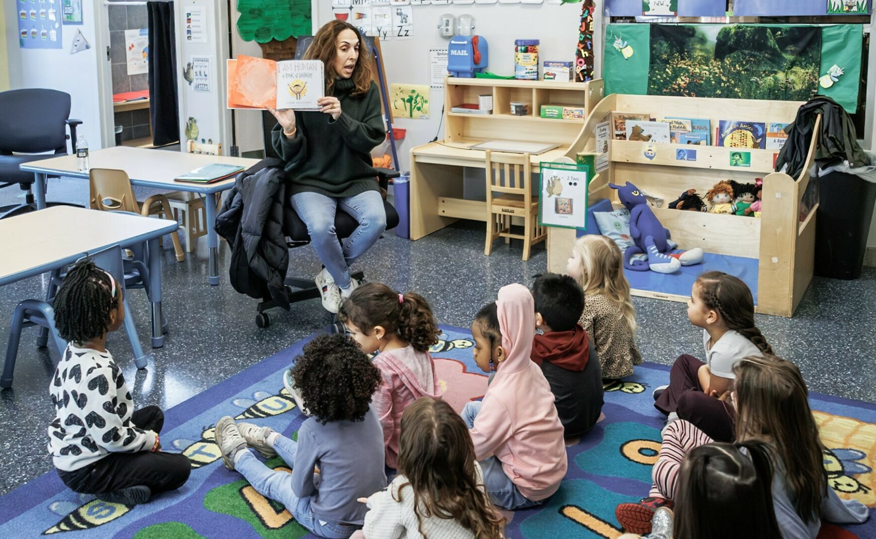 Volunteer reading to children during Read Across America Day event in 2025