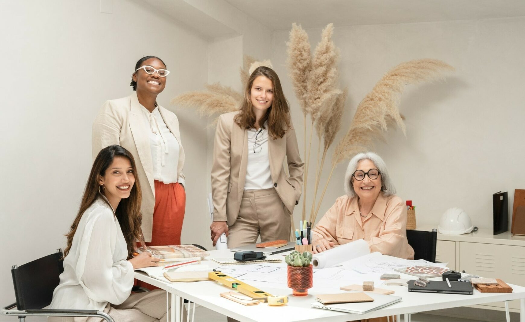 Business women at table smiling