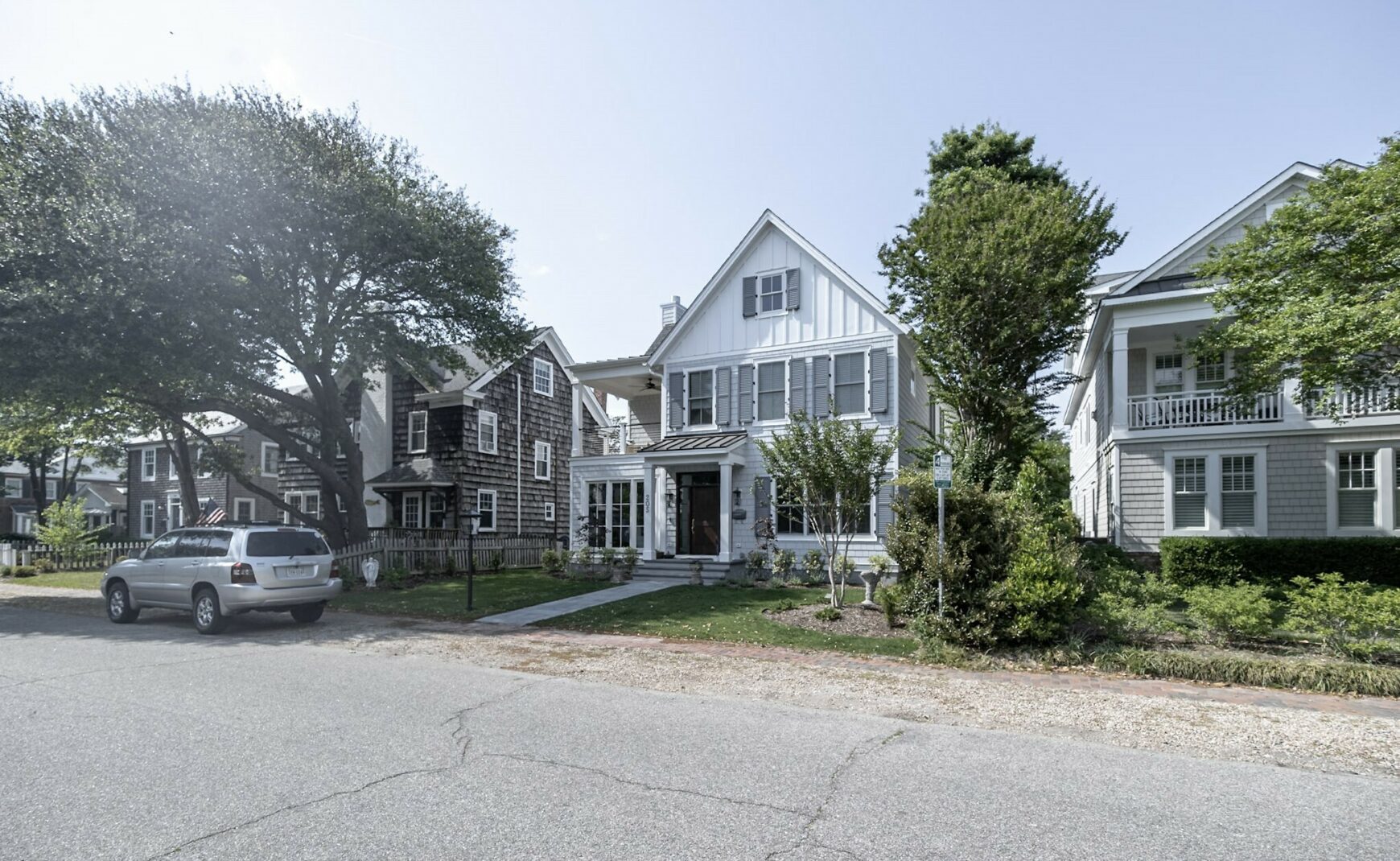 Coastal homes with suv parked in front