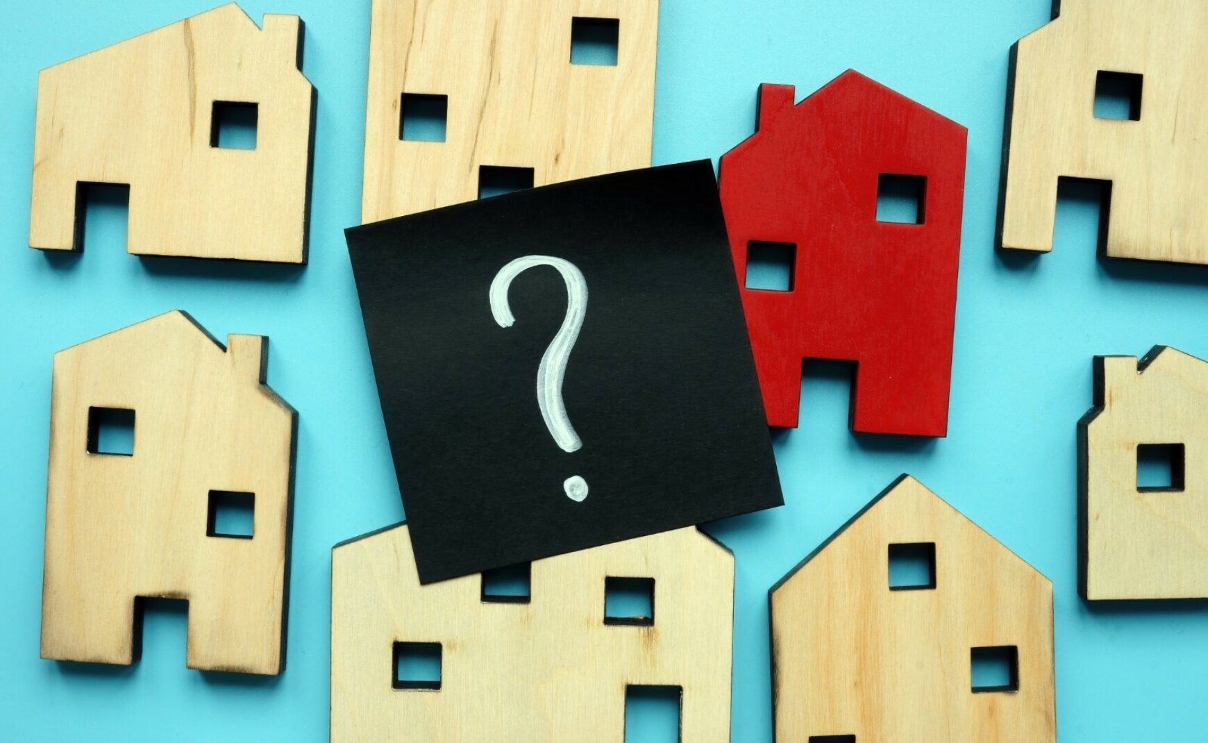 Graphic of wood houses and a question mark