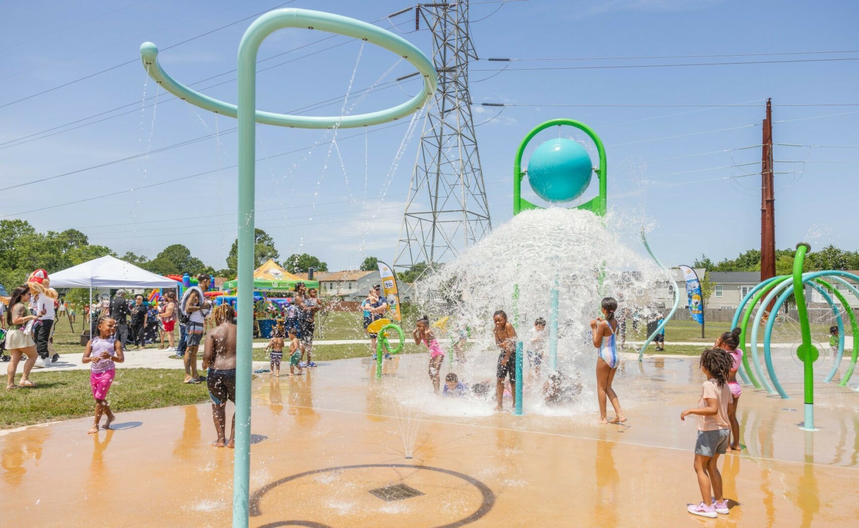 Kids play on sprayground at Level Green Park