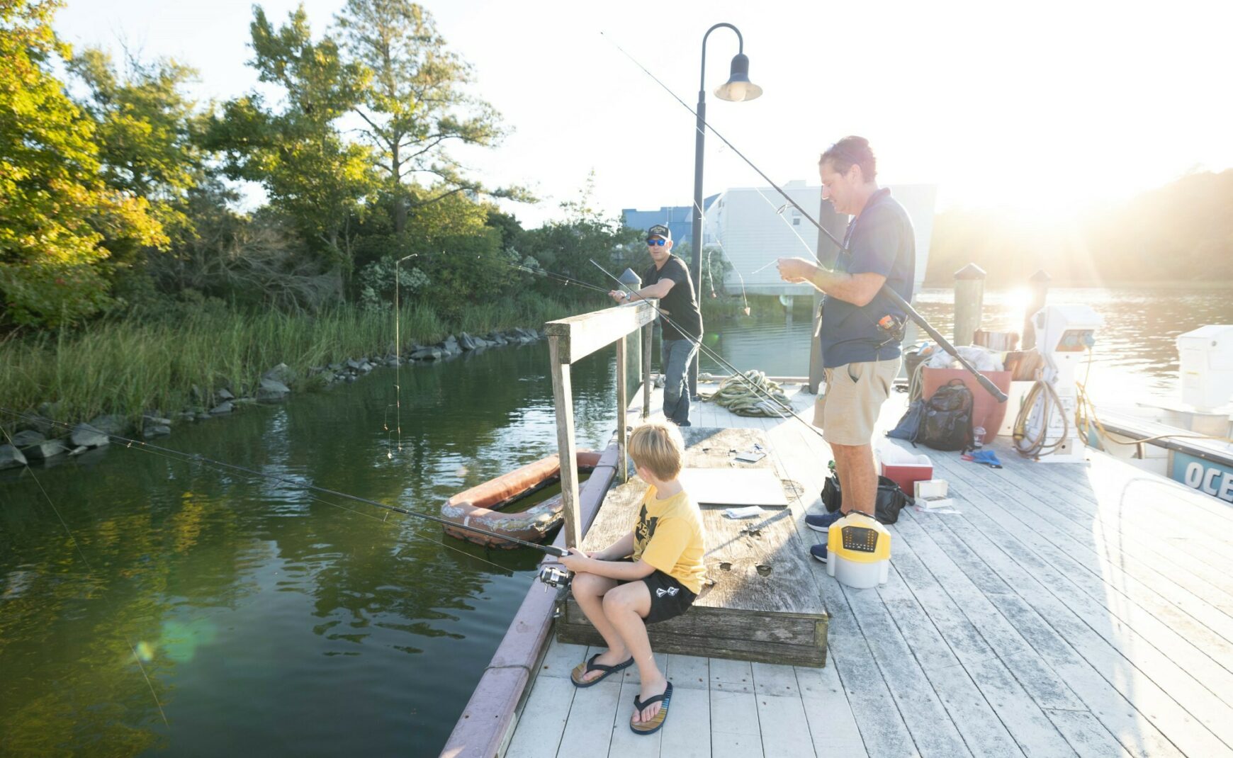 Men and boy fishing at the Virginia Aquarium