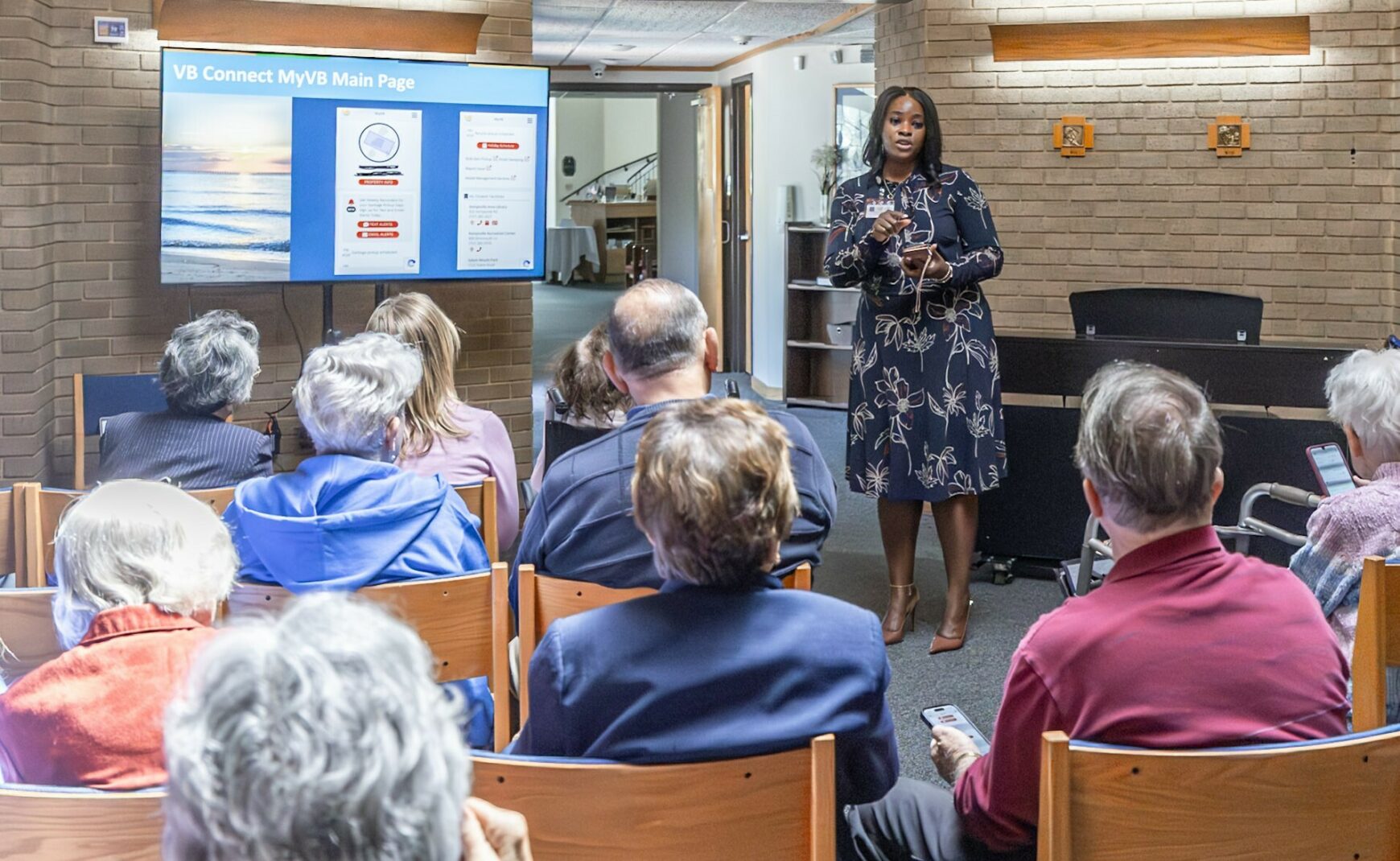 Woman talking to audience as part of speakers bureau