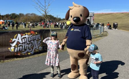 Barks and Rex posing with kids at Autumn in the Air festival