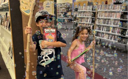 Boy and girl at library with bubbles