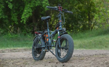 E bike on dirt path in front of trees