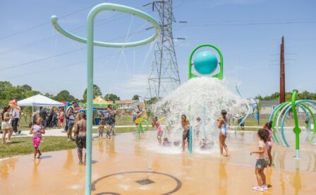 Kids play on sprayground at Level Green Park