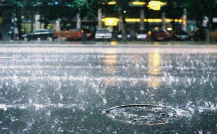 Storm drain with rainy background