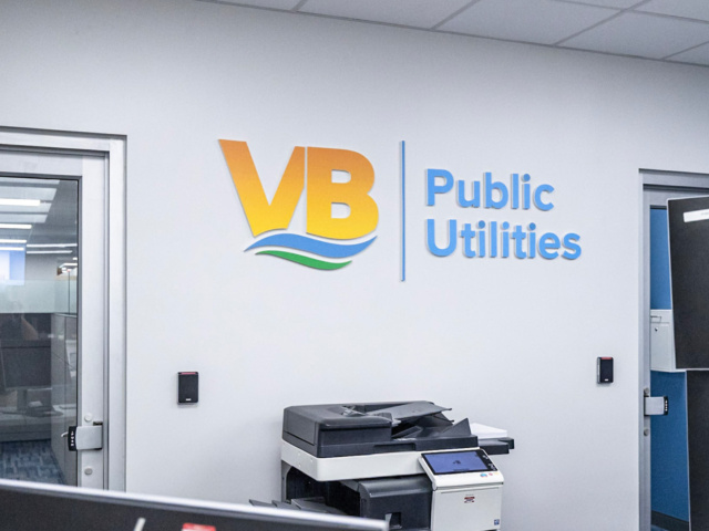 Public Utilities logo on white wall