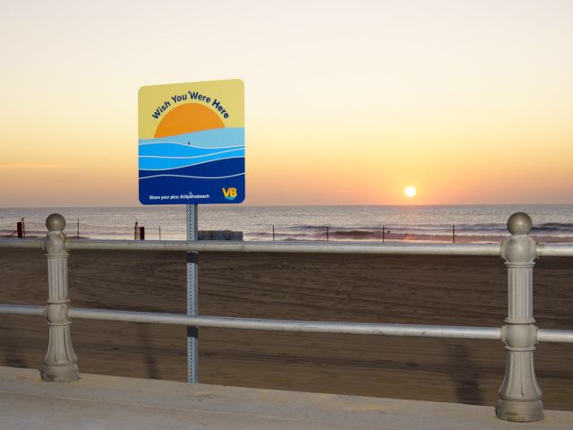 Wish you were here sign at oceanfront