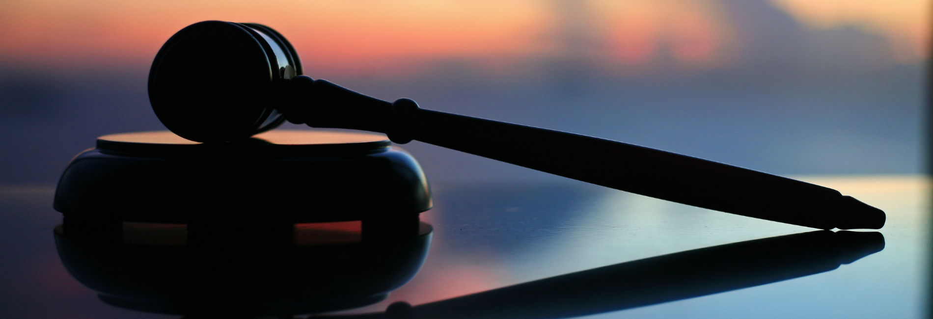 Judges gavel on sunset background