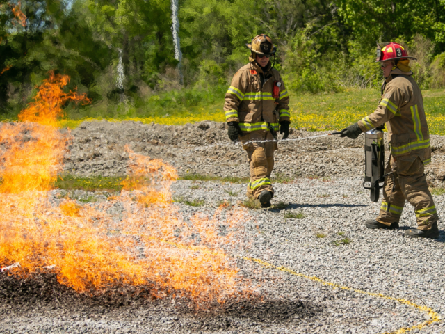 Firefighters practicing to extinguish a natrual gas fire