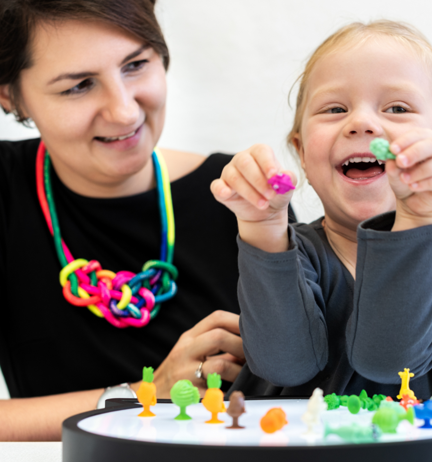 Therapist playing puzzle game with child Infant Program video thumbnail