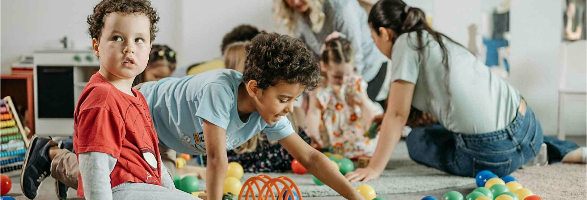 Children playing with little colorfull balls