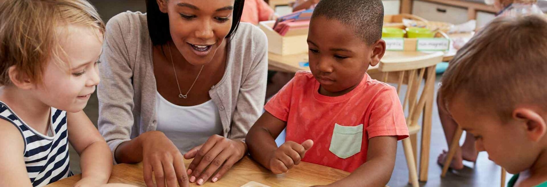 Preschool teacher playing games with kids