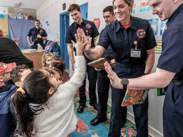 Firefighters reading to children