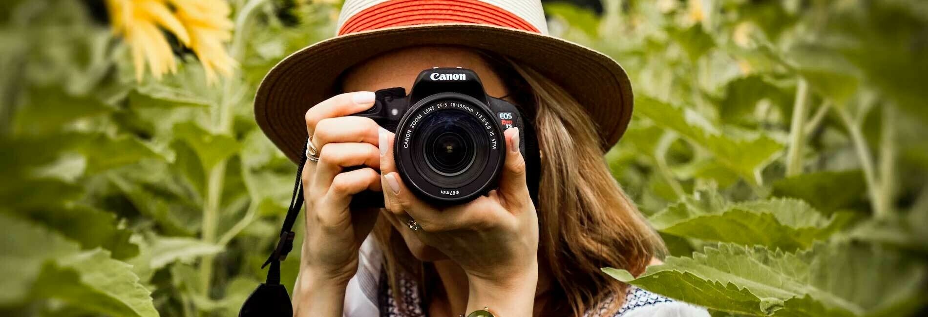 Woman Point Camera in Field