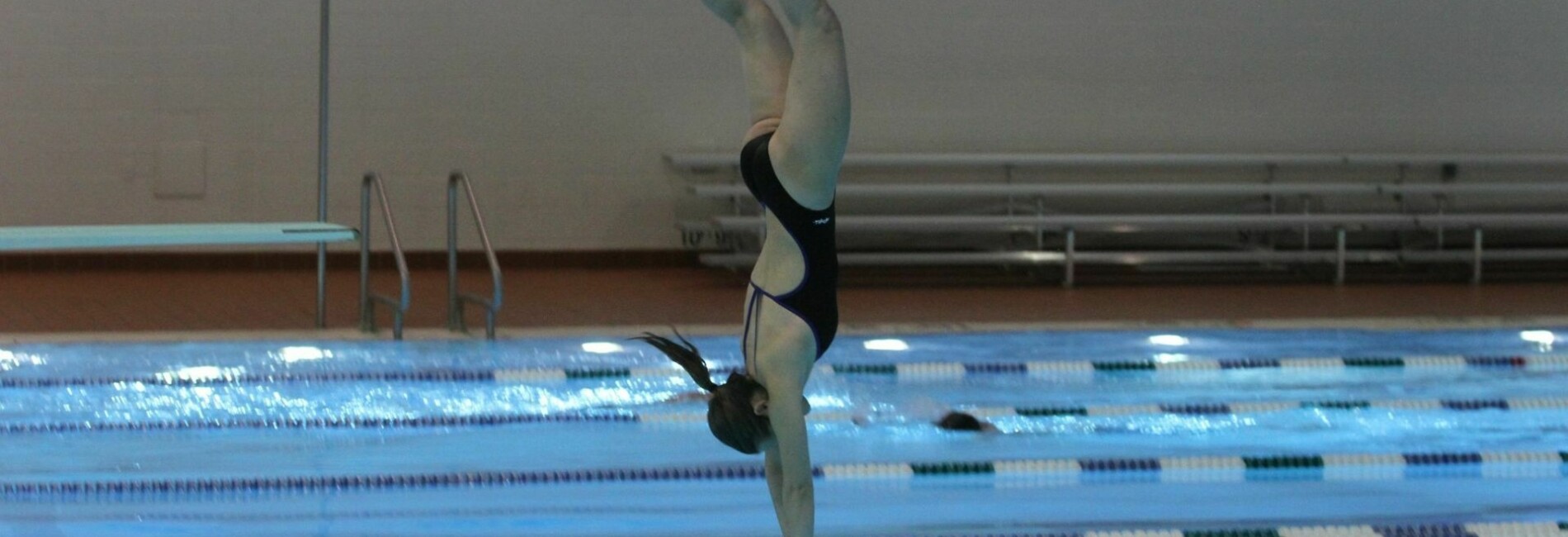 Woman diving into pool