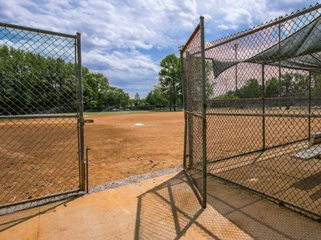 City view park baseball field with an open chain link fence