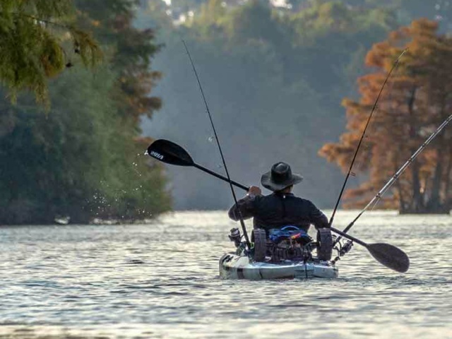 Fisherman in a small boat on Stumpty Lake