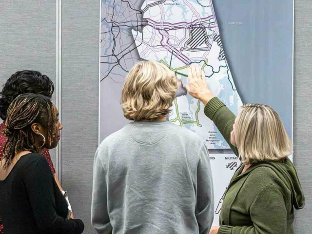 People reviewing a city map