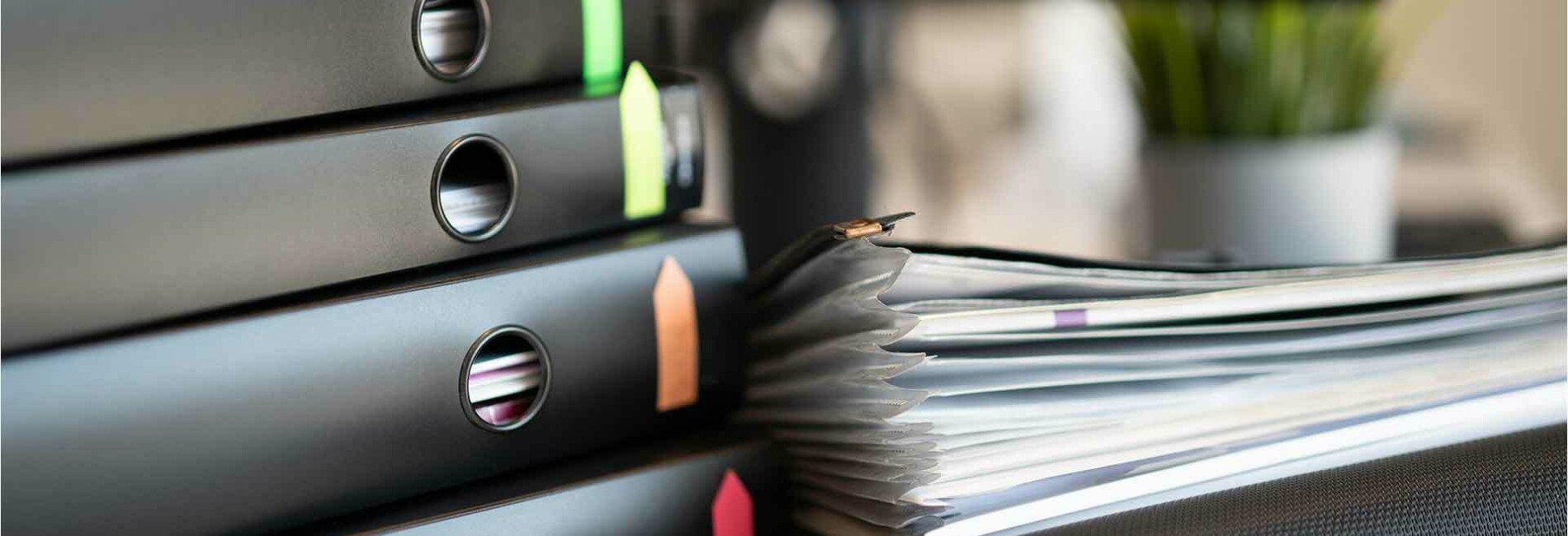 6 binders on a table