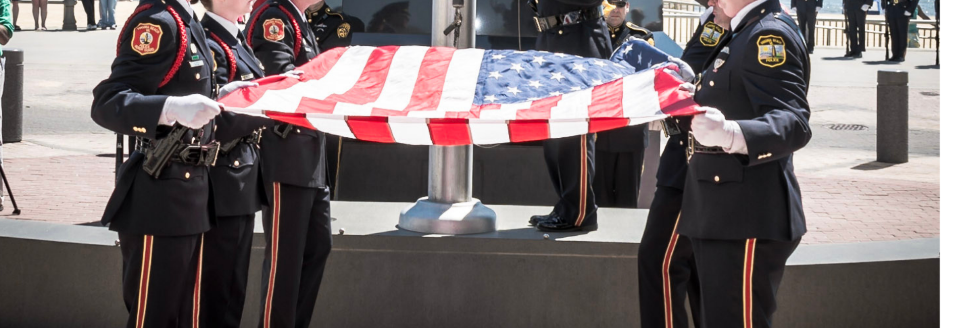 Honor guard members folding a U S flag at Law Enforcement Officer Memorial