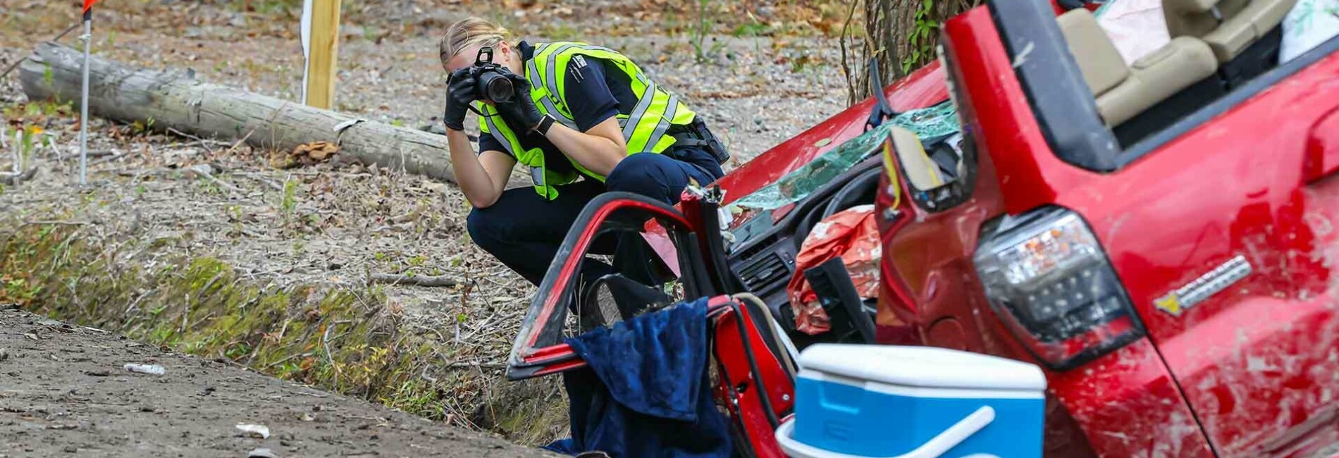 Police woman taking crime photos