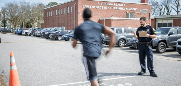 Police recruit running a lap at training center