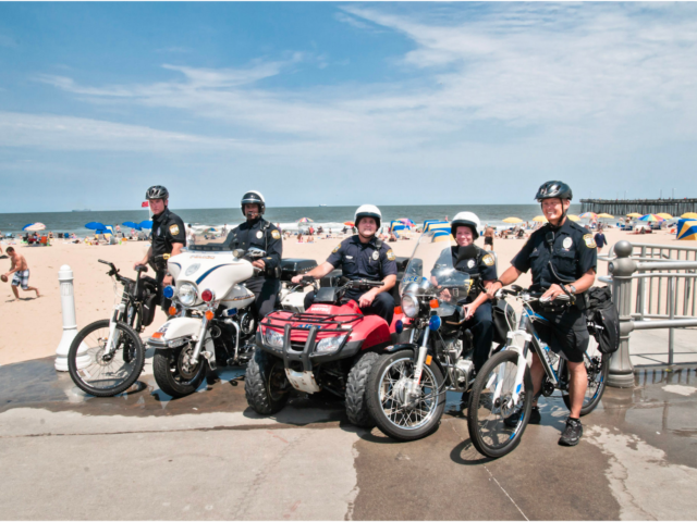 Group of police officers posed on the boardwalk