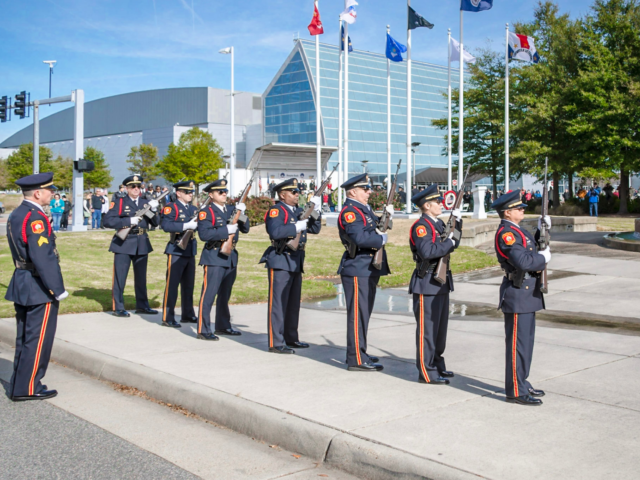 Honor guard members lined up at the Veterans Memorial