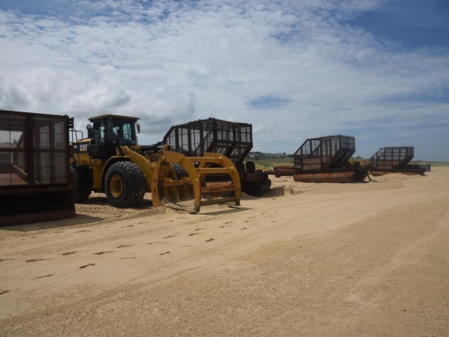 Dredge equipment staged on beach ready for work