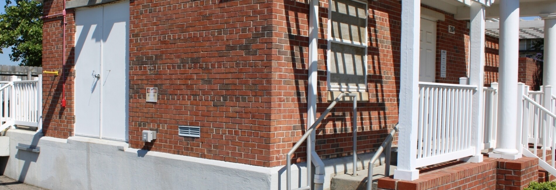 Home viewed from side with brick walls